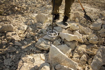 man with a metal detector in search of historical values.