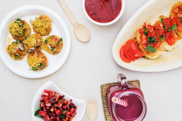 Eco-friendly Cutlery Demo consisting of Sev Puri, Salad, Tomato Garlic Bread, Beetroot Juice and...