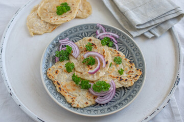 Onion naan - traditional indian bread. pita bread or scones with green onions