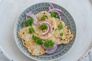 Onion naan - traditional indian bread. pita bread or scones with green onions