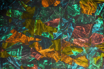 Texture torn into fragments of the picture. Shreds of torn colored paper. Puzzles