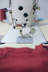 Close-up of sewing machine foot. Seamstress equipment