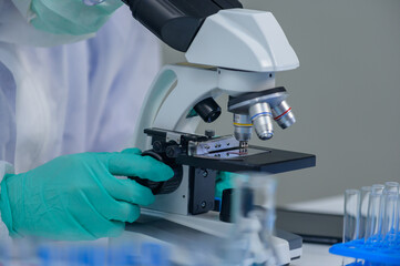 Scientist team has researching Coronavirus cure in the laboratory. Asian Doctor working on vaccine...