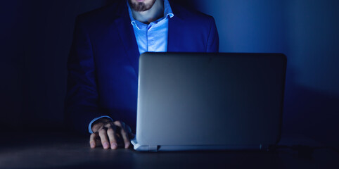 young man works with computer