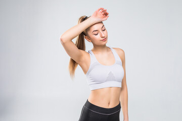 Fototapeta premium portrait of sporty woman look tired after workout on white background