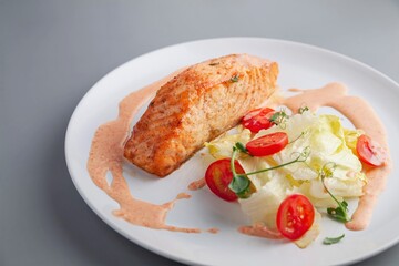 Salmon steak and vegetables