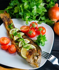 Fried fish served on the plate