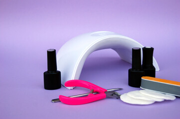 Set for manicure. Lamp for nails. Master of nail service.