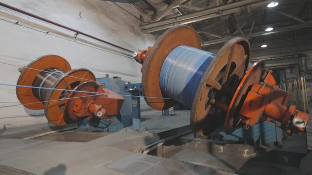 Cable production process. Multi-core cable weaving process, cable production in a modern factory. Multi-core cable production in a factory