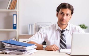 Young handsome businessman working in office