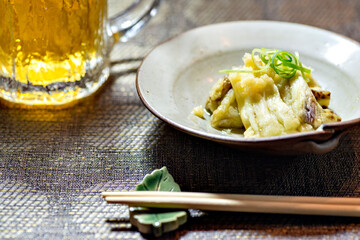 Grilled eggplant served with beer at supper in Japan
