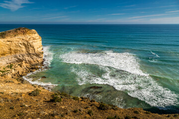 A beach next to the Twelve Apostles in Victoria, Australia at a sunny day in summer.