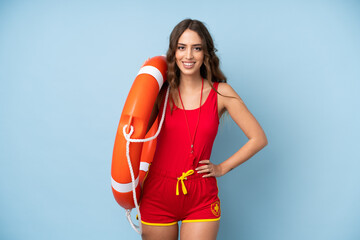 Young woman over isolated background with lifeguard equipment and with happy expression