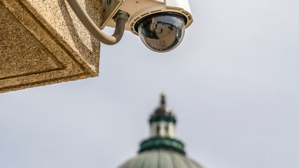 Fototapeta na wymiar Panorama frame Outdoor dome security cctv camera with Utah State Capital Building background