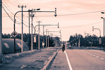 Fototapeta na wymiar 北海道 道東をサイクリングする旅人