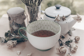 Cup of herbal tea dried flowers composition vintage 