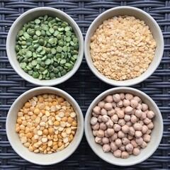 Round bowls with legumes, peas, chickpeas and lentils on a wicker brown background. High quality photo