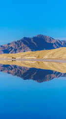 Vertical crop Landscape with reflections at Bonnievale Salt Flat
