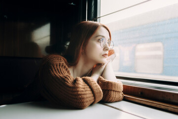 Girl travels in a train carriage