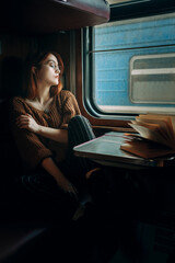 Girl travels in a train carriage