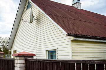 Dust and mold on the vinyl siding of the house.