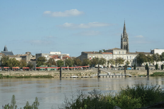 Panorama of Libourne seen from the Garonne river with a focus on the church of Eglise Saint Jean Baptiste. Libourne is a major town in Gironde, in the Aquitaine region