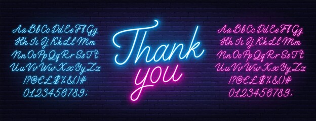 Neon pink and blue script font. Glowing alphabet with letters, numbers and special characters.Text thank you on a brick background. © TanyaFox