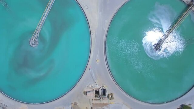 Aerial view of treatment basins near the mining and processing plant for copper ore mining.