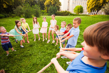 Children play with a rope in the park