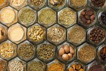 Art of food. Assorted ground spices in hexagon jars