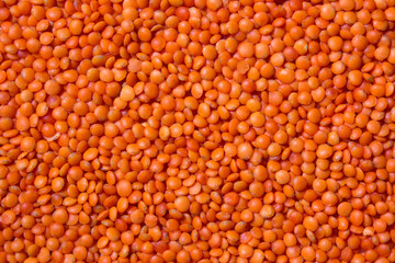 Background with red lentils. Lots of lentils. Raw ingredients for cooking. Healthy, clean eating concept.