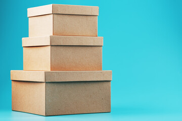 Cardboard boxes in the shape of a pyramid on a blue background.