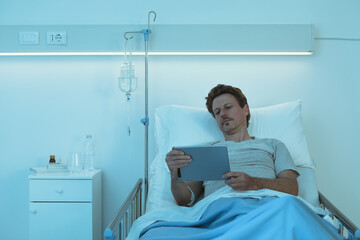 Patient watching movies with his digital tablet
