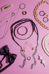 Women fashion accessories set on pink background, top view.
