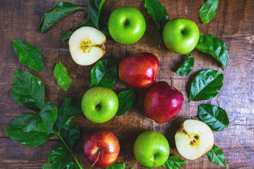 .Fresh fruit, green apple and red apple on a wooden background
