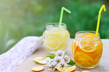 Homemade lemonade in cans in the open air. Selective focus