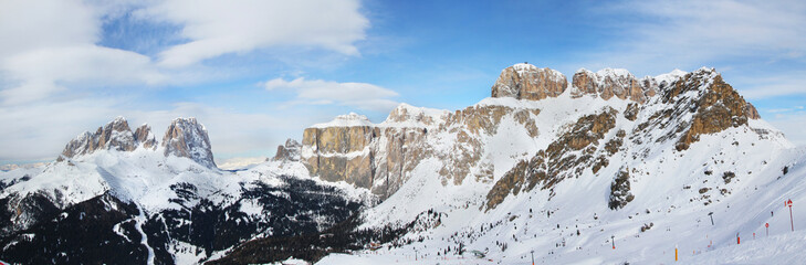 Panoramic winter view of Alpine mountains. Sella Ronda. Val di Fassa. Dolomite Alps. Trentino-Alto...