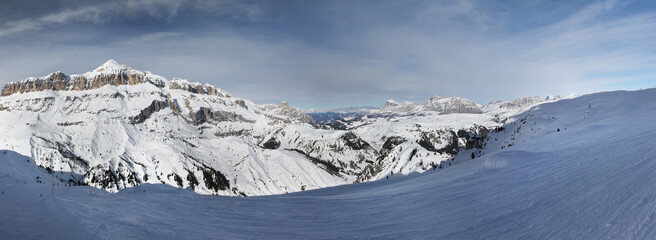 Panoramic winter view of Sella Group mountains and Arabba ski area. Sella Ronda. Porta Vescovo. Dolomites. South Tirol. Italy.