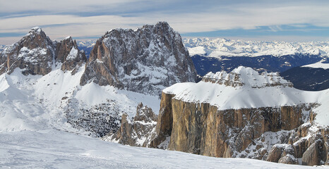 Panoramic winter view of Sella Group mountains form Pordoi Pass. South Tirol. Dolomites. Italy.