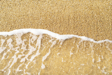 Close up Soft waves on sandy beach