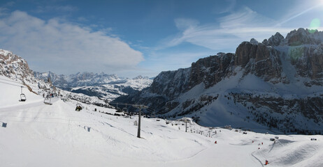 Panoramic winter view of Sella Group mountains and Alta Badia ski area. Sella Ronda. Dantercepies. Dolomites. South Tirol. Italy.