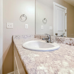 Square frame Top mount sink with stainless steel faucet on bathroom marble countertop