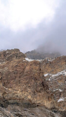 Vertical Rocky mountain scenery with overcast sky overhead in Provo Canyon Utah in winter