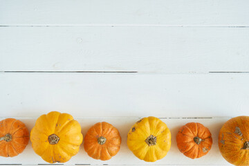 Autumn background of pumpkins on a wooden table. Halloween concept Vintage Copy space