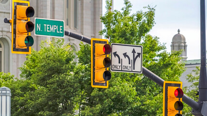 Panorama crop Traffic lights and road signs mounted on metal pole in Salt Lake City Utah