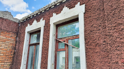 Ruined old house. And the blue sky. The remains of old houses. Abandoned city. The city of ghosts. The ruins of old historic buildings destroyed by an earthquake.