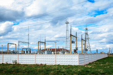 Fototapeta premium High voltage post. High voltage tower on blue background.