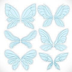 Blue fairy wings with dotted outline for cutting set isolated on a white background