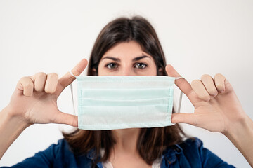 Young woman wearing medical protective mask