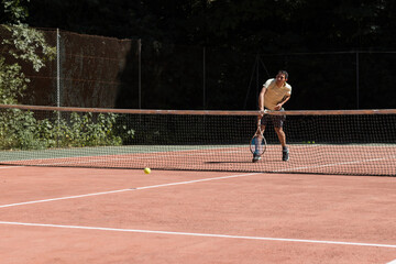 professional tennis player playing with racket